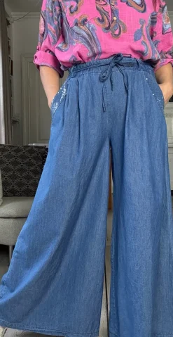 Caro denimbukser med pailletlommer og bindebånd medium denim LikeLondon